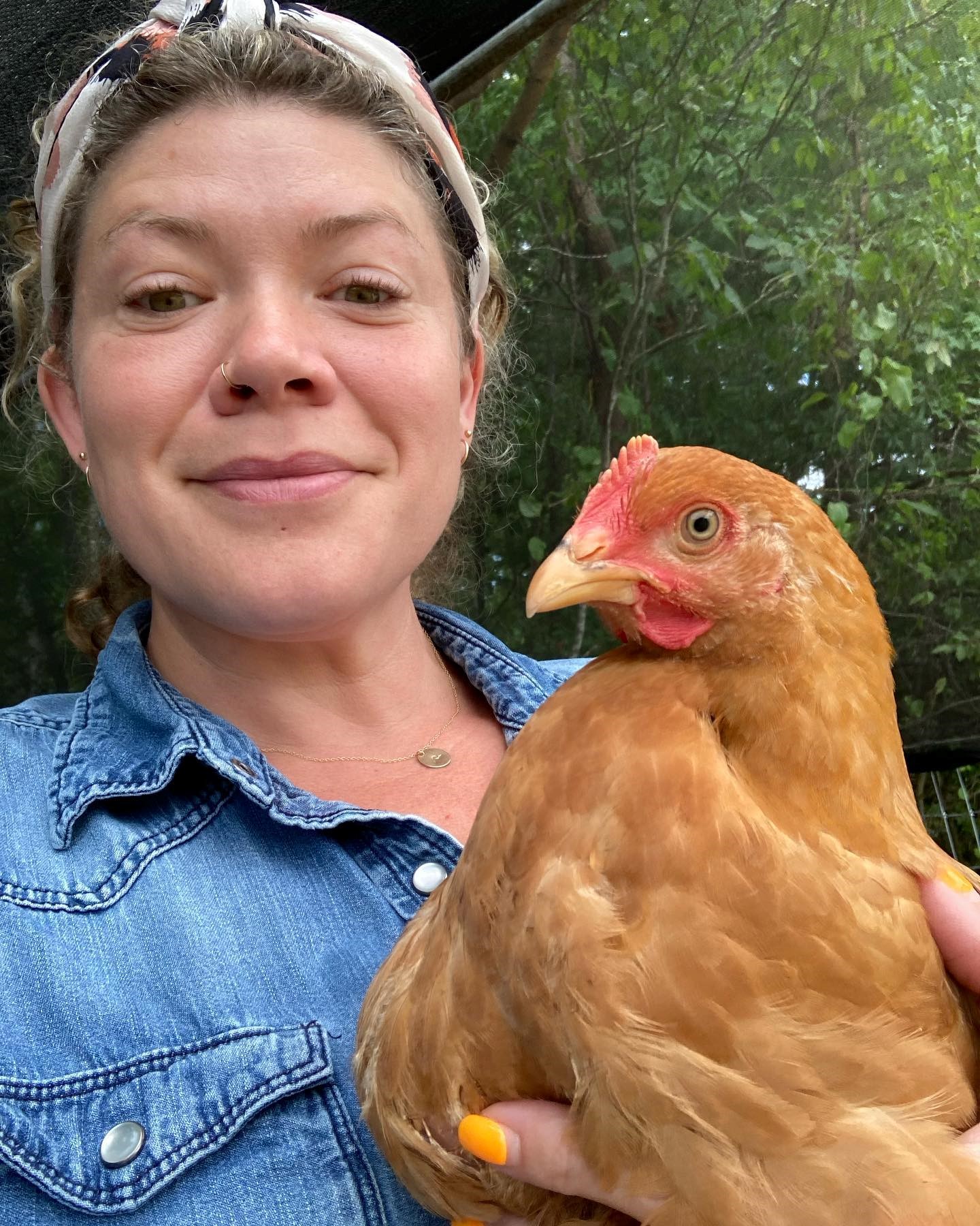 Whitney Sewell holding a chicken